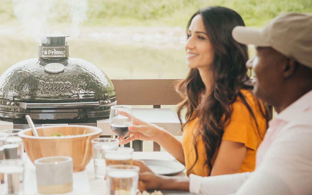 Primo grills round charcoal grill at dinner table